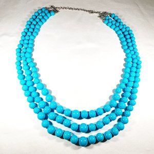 Sleeping Beauty colored simulated pearl three row necklace 23-27 in silvertone